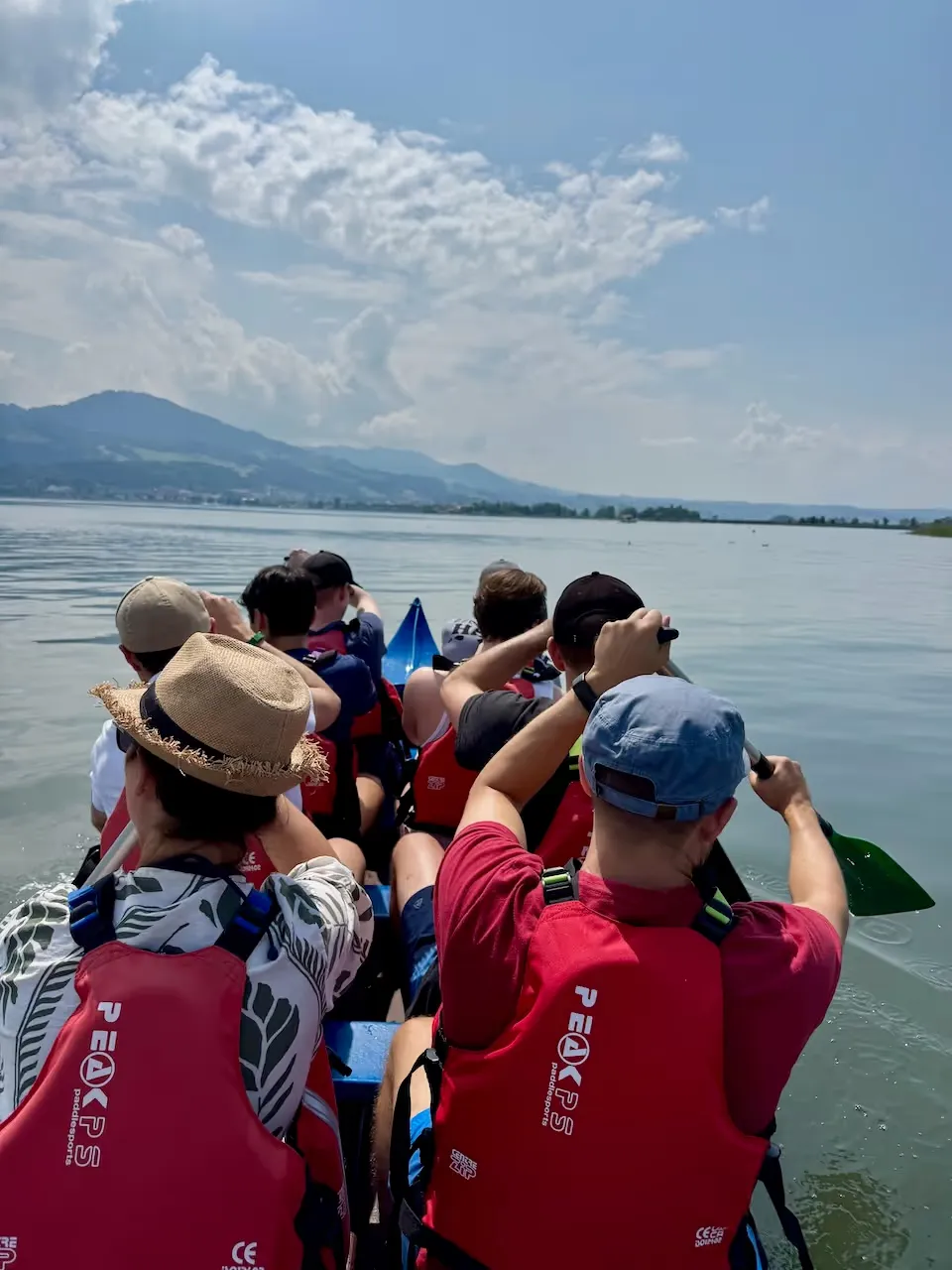 The Paymira team paddling together on the lake